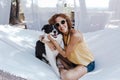 Young beautiful woman sitting on hammock with her border collie dog outdoors. Fun and summer lifestyle Royalty Free Stock Photo