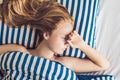 Young beautiful woman sleeping in her bed and relaxing in the morning Royalty Free Stock Photo