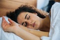 Beautiful young woman sleeping in bed. Royalty Free Stock Photo