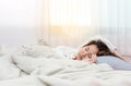 Young beautiful woman sleeping her bed and relaxing Royalty Free Stock Photo