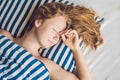 Young beautiful woman sleeping in her bed and relaxing in the morning Royalty Free Stock Photo