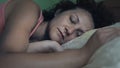 Young beautiful woman sleeping in her bed Royalty Free Stock Photo