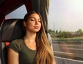 Young beautiful woman sleeping sitting in the bus. Bus passenger traveling sitting in a seat and sleeping Royalty Free Stock Photo