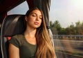 Young beautiful woman sleeping sitting in the bus. Bus passenger traveling sitting in a seat and sleeping Royalty Free Stock Photo