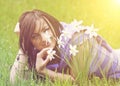 Young woman smelling daffodils Royalty Free Stock Photo