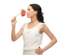 Young and beautiful woman smelling flower Royalty Free Stock Photo