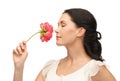 Young and beautiful woman smelling flower Royalty Free Stock Photo