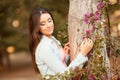 Young beautiful woman smells flowers Royalty Free Stock Photo