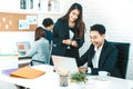 Young beautiful woman smile and discussing work with her coworker Royalty Free Stock Photo