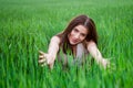 Young beautiful woman smiling in green field Royalty Free Stock Photo