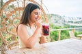 Young beautiful woman smiling happy drinking cocktail Royalty Free Stock Photo