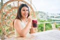 Young beautiful woman smiling happy drinking cocktail Royalty Free Stock Photo