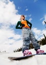 Young beautiful woman on the snowboard Royalty Free Stock Photo