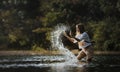 Young beautiful woman splashing water on summer vacation holiday relaxing. Royalty Free Stock Photo