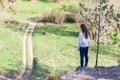 Young beautiful woman standing on the edge of a cliff Royalty Free Stock Photo