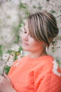 Young beautiful woman standing near blooming white cherry tree Royalty Free Stock Photo