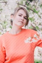 Young beautiful woman standing near blooming white cherry tree Royalty Free Stock Photo