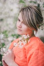 Young beautiful woman standing near blooming white cherry tree Royalty Free Stock Photo