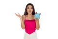 Young beautiful woman standing with piggy bank money box Royalty Free Stock Photo