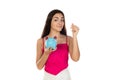 Young beautiful woman standing with piggy bank money box Royalty Free Stock Photo