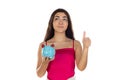 Young beautiful woman standing with piggy bank money box Royalty Free Stock Photo