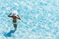 Young beautiful woman standing in the sea and enjoying summer. Summer fun, vacation, holidays, enjoy life concept Royalty Free Stock Photo