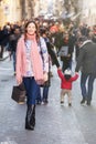 Young beautiful woman stands in a crowd of citizens