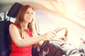 Young beautiful woman steering wheel driving a car Royalty Free Stock Photo