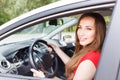 Young beautiful woman steering wheel driving a car Royalty Free Stock Photo