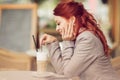 Young beautiful woman in a street cafe enjoying a coffee, summerly urban mood