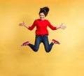 Young beautiful woman in studio, jumping. Royalty Free Stock Photo