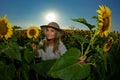 Young beautiful woman on sunflower field Royalty Free Stock Photo