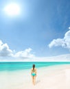 Young and beautiful woman in swimsuit relaxing on the beach. Girl having summer vacation in Thailand. Holidays and Royalty Free Stock Photo