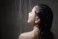 Young beautiful woman taking shower in a bathroom at home Royalty Free Stock Photo