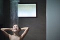 Young beautiful woman taking shower in a bathroom at home Royalty Free Stock Photo