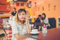 Young beautiful woman talking phone at coffee shop look so happy Royalty Free Stock Photo