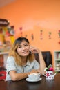 Young beautiful woman talking phone at coffee shop look so happy Royalty Free Stock Photo