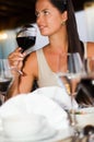 Young Beautiful woman tasting red wine