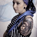 Young beautiful woman with tattoo and dreadlocks Royalty Free Stock Photo