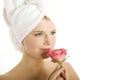 Young beautiful woman in towel with pink flower Royalty Free Stock Photo