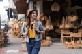 Young beautiful woman traveling at the local market during vacation. Tourist women travel in Chiang mai enjoy shopping Royalty Free Stock Photo