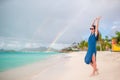 Young beautiful woman on tropical seashore. Happy girl relaxing at white sand tropical beach Royalty Free Stock Photo