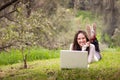 Young beautiful woman using a laptop computer at the park Royalty Free Stock Photo