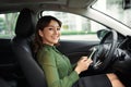 Young beautiful woman using smartphone while driving car Royalty Free Stock Photo