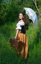 Young beautiful woman in vintage dress with old su Royalty Free Stock Photo