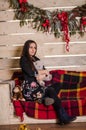 Young beautiful woman waiting christmas at home