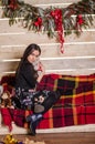 Young beautiful woman waiting christmas at home