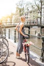 Woman with bicycle in Amsterdam city Royalty Free Stock Photo