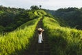 Woman walking on Campuhan Ridge way Bali, Ubud in morning