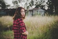 Young beautiful woman walking through in summer field, Freedom e Royalty Free Stock Photo